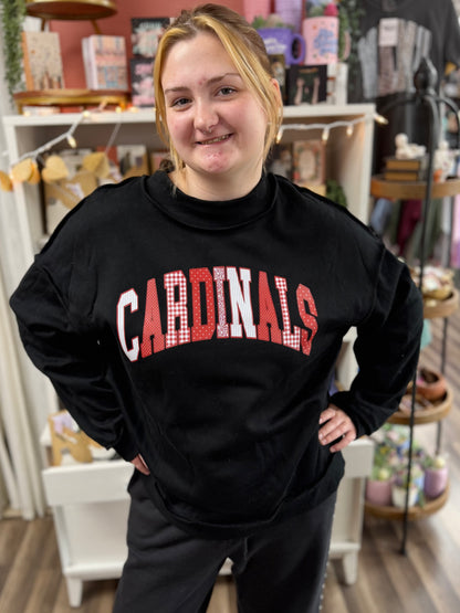 cardinals patterned letters on black mockneck